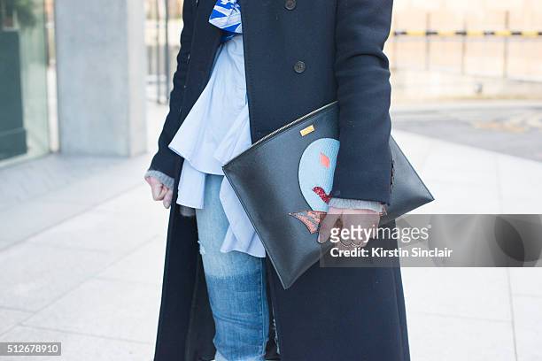 Barneys New York assistant fashion director Hannah Bibb wears a Stella McCartney bag on day 4 during London Fashion Week Autumn/Winter 2016/17 on...