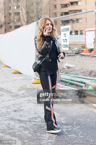 System magazine co-founder Alexia Niedzielski who wears Peter Pilotto trousers and a Louis Vuitton jacket and bag on day 4 during London Fashion Week...