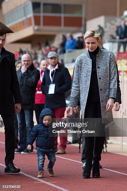 Princess Charlene of Monaco and Prince Jacques attend the 6th Sainte Devote Rugby Tournament at Stade Louis II on February 27, 2016 in Monaco, Monaco.