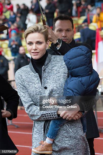 Princess Charlene of Monaco and Prince Jacques attend the 6th Sainte Devote Rugby Tournament at Stade Louis II on February 27, 2016 in Monaco, Monaco.