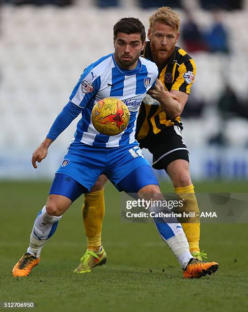 Elliot Lee of Colchester United and Zak Whitbread of Shrewsbury Town during the Sky Bet League One match between Colchester United and Shrewsbury...