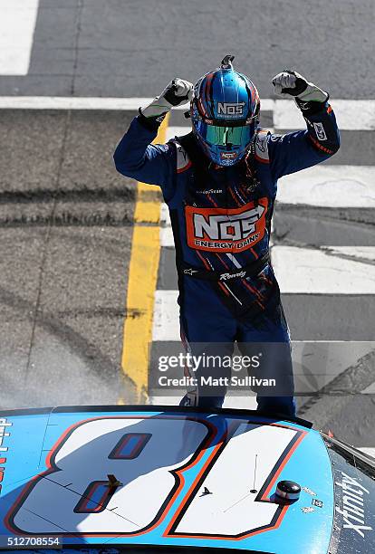 Kyle Busch, driver of the NOS Energy Drink Toyota, celebrates winning the NASCAR XFINITY Series Heads Up Georgia 250 at Atlanta Motor Speedway on...