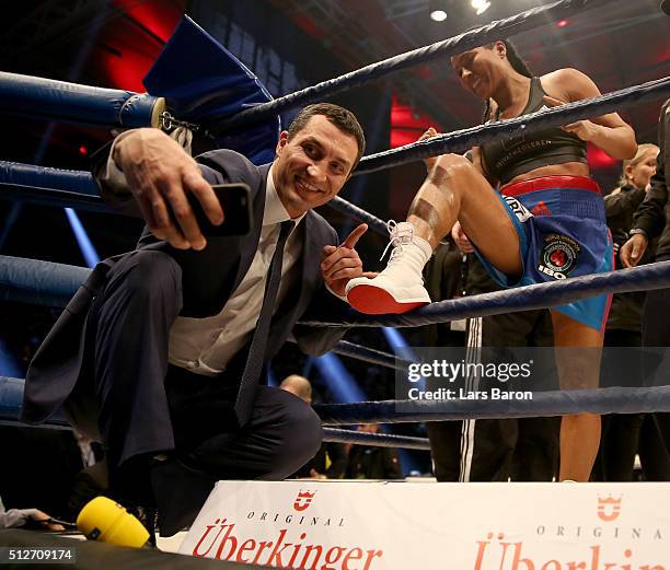 Wladimir Klitschko takes a selfie with winner Cecilia Braekhus after her Welterweight World Championship fight against Chris Namus prior to the IBO...