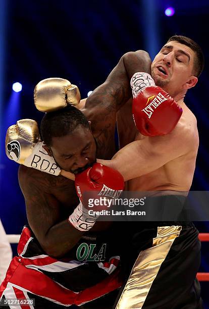 Marco Huck and Ola Afolabi in action during the IBO Cruiserweight World Championship fight between Marco Huck and Ola Afolabi at Gerry Weber Stadium...