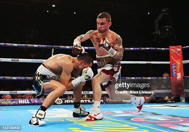 Scott Quigg evades a punch from Carl Frampton during their World Super-Bantamweight title contest at Manchester Arena on February 27, 2016 in...