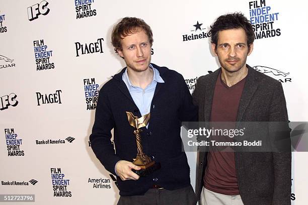 Director Laszlo Nemes, winner of the Best International Film award for 'Son of Saul' , and Actor Geza Rhrig pose in the press room during the 2016...