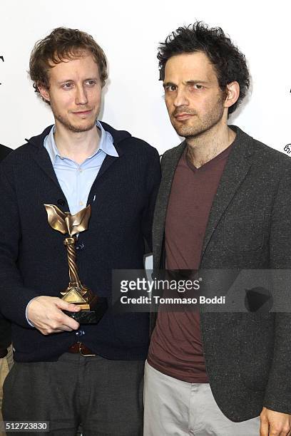 Director Laszlo Nemes, winner of the Best International Film award for 'Son of Saul' , and Actor Geza Rhrig pose in the press room during the 2016...