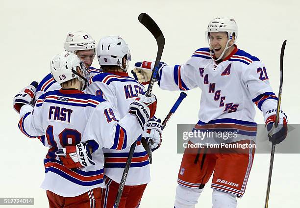 Kevin Klein of the New York Rangers celebrates with Ryan McDonagh of the New York Rangers, Derek Stepan of the New York Rangers and Jesper Fast of...