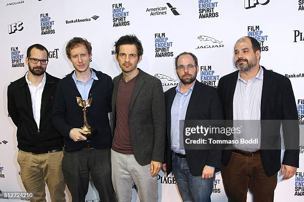 Director Laszlo Nemes , winner of the Best International Film award for 'Son of Saul' , and the cast and crew of 'Son of Saul' pose in the press room...