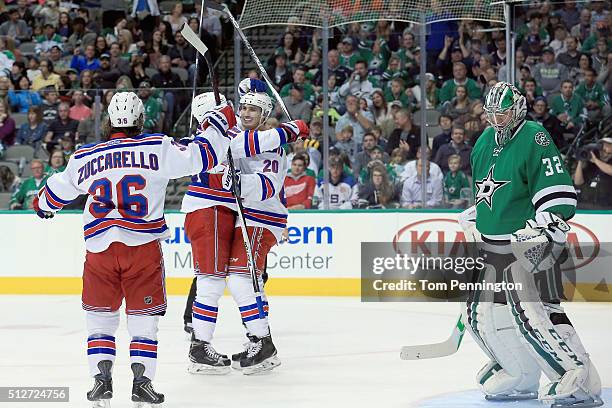 Chris Kreider of the New York Rangers celebrates with Mats Zuccarello of the New York Rangers and Derick Brassard of the New York Rangers after...