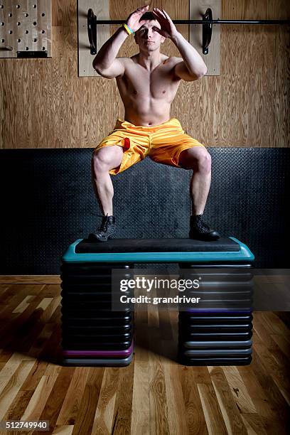 physically fit young man doing box jump - physically active stock pictures, royalty-free photos & images