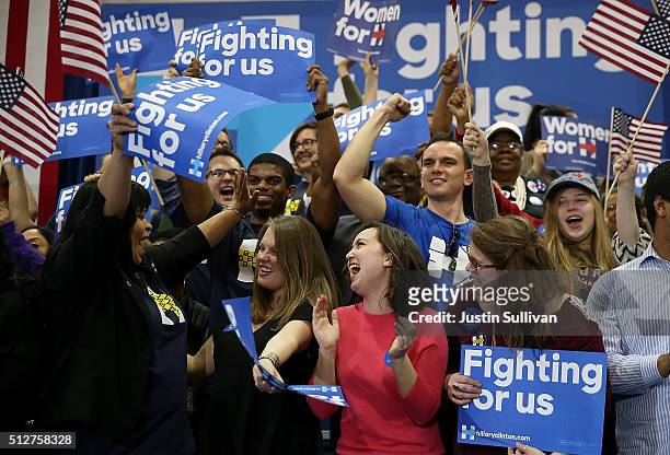 Supporters of Democratic presidential candidate Hillary Clinton celebrate during her primary night gathering at the University of South Carolina on...