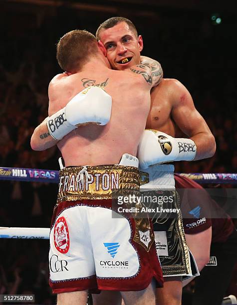 Carl Frampton and Scott Quigg embrace after their World Super-Bantamweight title contest at Manchester Arena on February 27, 2016 in Manchester,...