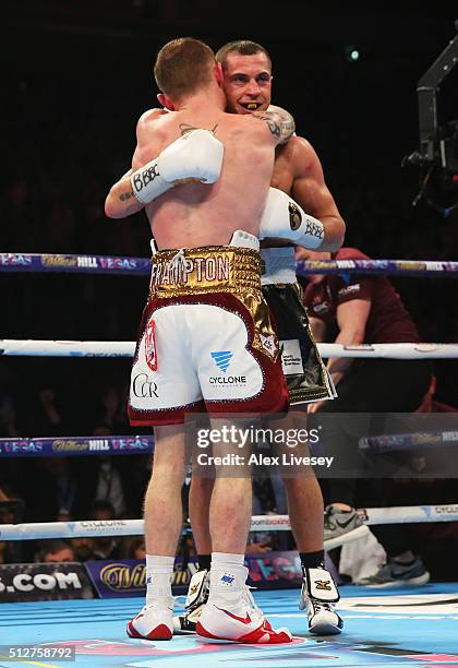 Carl Frampton and Scott Quigg embrace after their World Super-Bantamweight title contest at Manchester Arena on February 27, 2016 in Manchester,...