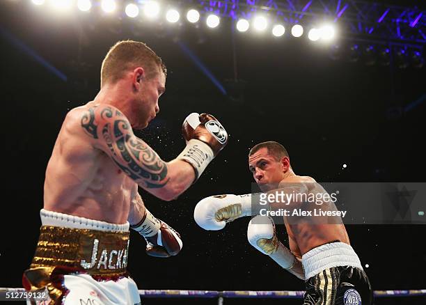 Carl Frampton and Scott Quigg in action during their World Super-Bantamweight title contest at Manchester Arena on February 27, 2016 in Manchester,...