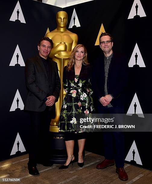 Makeup and Hairstyling artists from the film 'The Revenant' Robert Pandini , Sian Grigg and Duncan Jarman pose beside a statue of the Oscar at a...