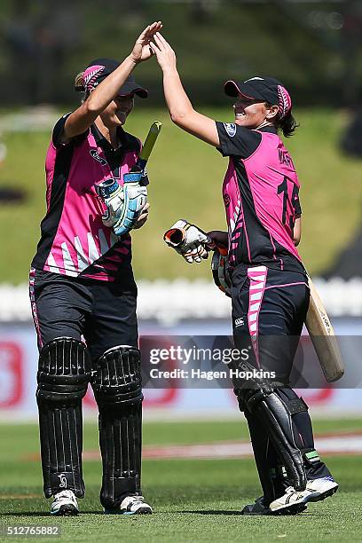 Sophie Devine and Katey Martin of New Zealand celebrate after winning the match one of the Trans-Tasman Twenty20 Series at Basin Reserve on February...