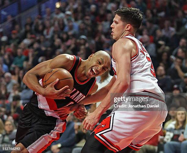 Damian Lillard of the Portland Trail Blazers drives against Doug McDermott of the Chicago Bulls at the United Center on February 27, 2016 in Chicago,...