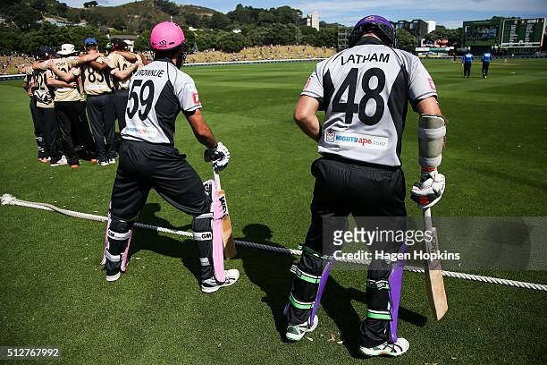 Dean Brownlie and Tom Latham of South Island prepare to take the field during the Island of Origin Twenty20 at Basin Reserve on February 28, 2016 in...