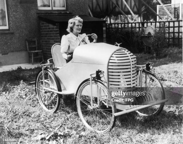 Mrs Dado in her cycle-powered car, 1947.