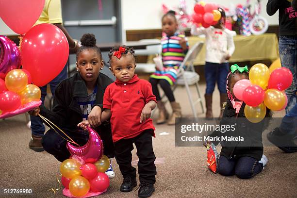 Children and families from the local community attend a birthday party for a 4 year old girl, A'nara, at the Cordova Town Hall polling precinct on...