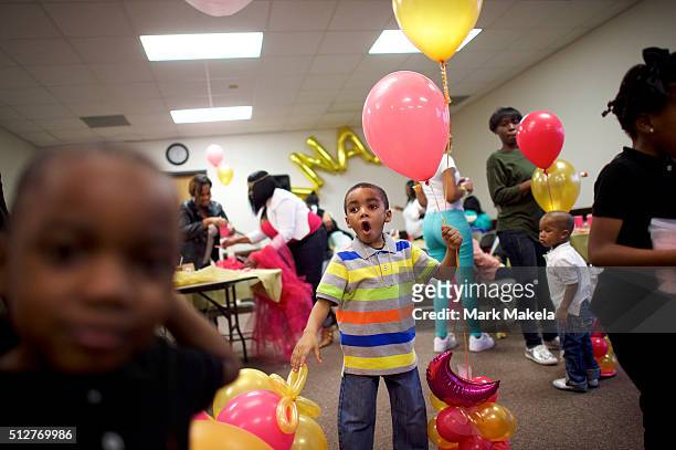 Children and families from the local community held a birthday party for a 4 year old girl, A'nara, at the Cordova Town Hall polling precinct on the...
