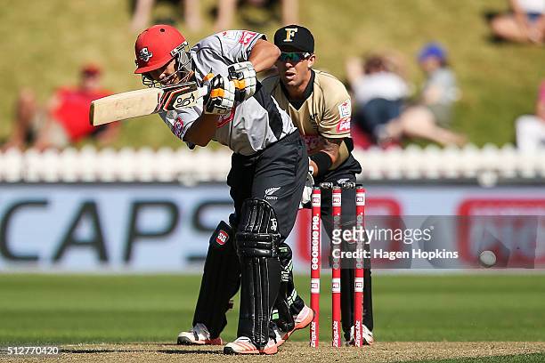 Ken McClure of South Island bats while Luke Ronchi of North Island looks on during the Island of Origin Twenty20 at Basin Reserve on February 28,...