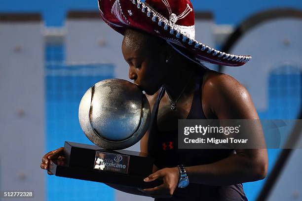 Sloane Stephens of USA kisses the trophy after winning the woman's final singles match between Dominika Cibulkova of Slovakia and Sloane Stephens of...