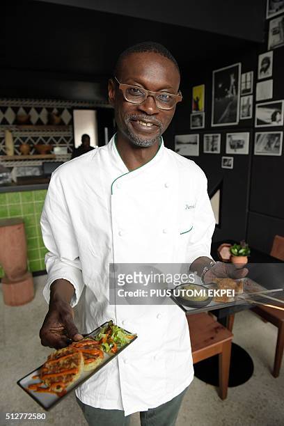 Senegalese pioneer of African cuisine Pierre Thiam tries to serve clients with food he prepared at Nok By Alara, a restaurant in Victoria Island...