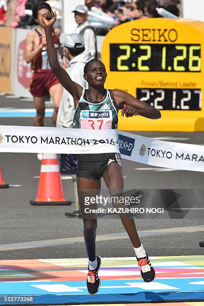 Kenya's Helah Kiprop celebrates as she crosses the finish line and wins the women's category of the Tokyo Marathon in Tokyo on February 28, 2016. AFP...