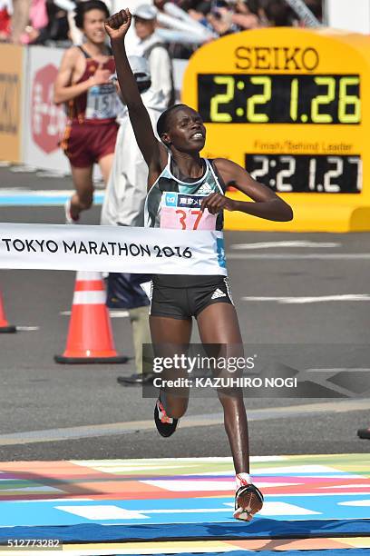 Kenya's Helah Kiprop celebrates as she crosses the finish line and wins the women's category of the Tokyo Marathon in Tokyo on February 28, 2016. AFP...