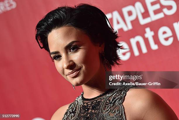 Singer Demi Lovato arrives at the 2016 MusiCares Person of the Year honoring Lionel Richie at Los Angeles Convention Center on February 13, 2016 in...