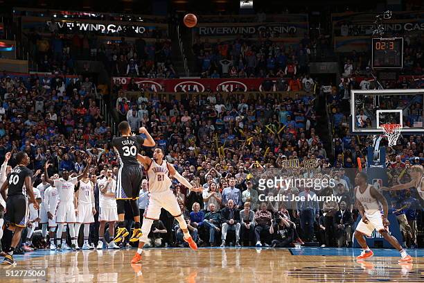 Stephen Curry of the Golden State Warriors hits the winning shot against Andre Roberson of the Oklahoma City Thunder on February 27, 2016 at...
