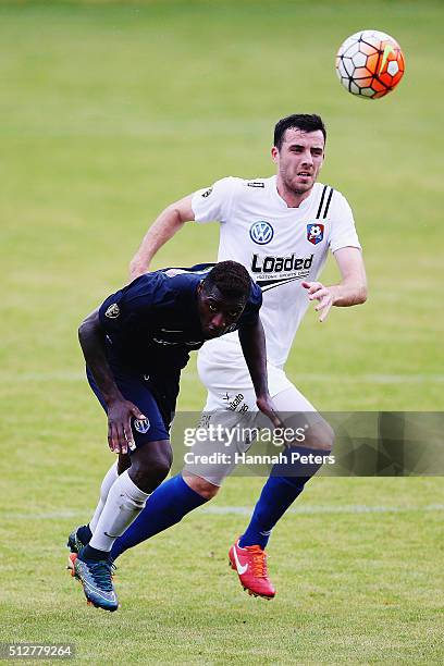 Joao Moreira of Auckland City heads the ball past Tyler Lissette of WaiBOP during the ASB Premiership match between Auckland City FC and WaiBOP...