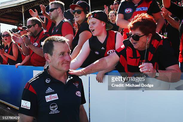 Bombers coach John Worsfold is greeted by fans after their win during the 2016 AFL NAB Challenge match between Carlton and Essendon at Ikon Park on...
