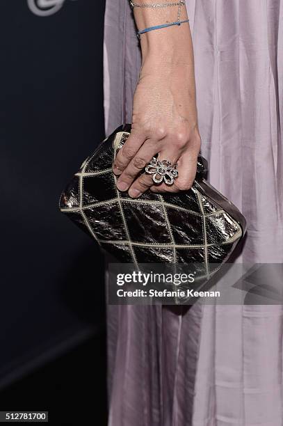 Producer Livia Giuggioli, ring, purse and fashion details, attends The Weinstein Company's Pre-Oscar Dinner presented in partnership with FIJI Water,...