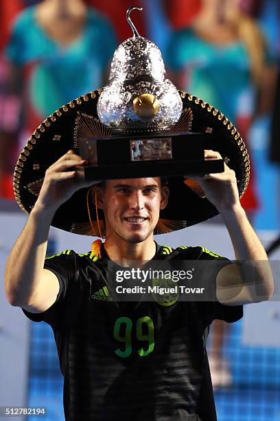 Dominic Thiem of Austria poses for pictures after winning the men's final singles match between Bernard Tomic of Australia and Dominic Thiem of...