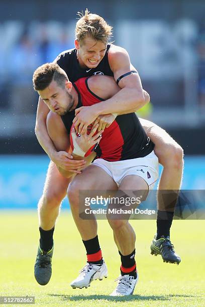 Ciaran Byrne of the Blues tackles Jackson Merrett of the Bombers during the 2016 AFL NAB Challenge match between Carlton and Essendon at Ikon Park on...