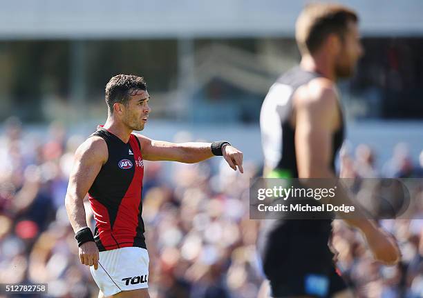 Ryan Crowley of the Bombers gestures to a teammate to centre the ball during the 2016 AFL NAB Challenge match between Carlton and Essendon at Ikon...