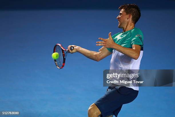 Dominic Thiem of Austria returns the ball during the men's final singles match between Bernard Tomic of Australia and Dominic Thiem of Austria as...