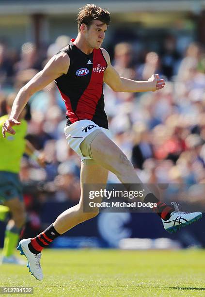 Sam Grimley of the Bombers kicks the ball during the 2016 AFL NAB Challenge match between Carlton and Essendon at Ikon Park on February 28, 2016 in...