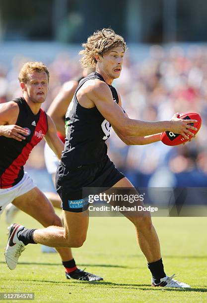 Mark Whiley of the Blues runs with the ball during the 2016 AFL NAB Challenge match between Carlton and Essendon at Ikon Park on February 28, 2016 in...