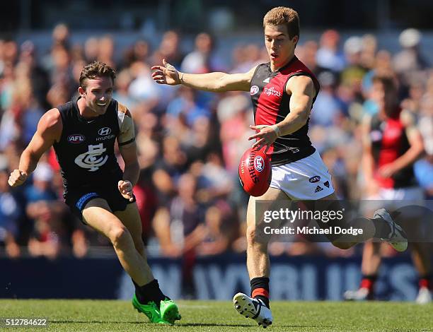 Zach Merrett of the Bombers kicks the ball during the 2016 AFL NAB Challenge match between Carlton and Essendon at Ikon Park on February 28, 2016 in...