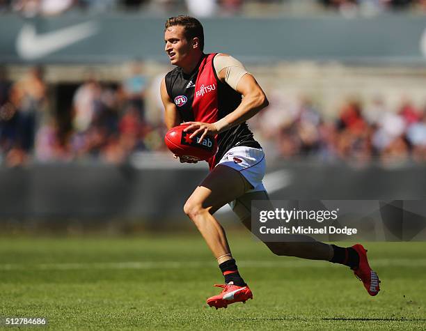 Orazio Fantasia of the Bombers runs with the ball during the 2016 AFL NAB Challenge match between Carlton and Essendon at Ikon Park on February 28,...