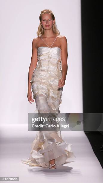 Models walk down the runway at the Caroline Herrera show during Olympus Fashion Week Spring 2005 at Bryant Park September 9, 2004 in New York City.