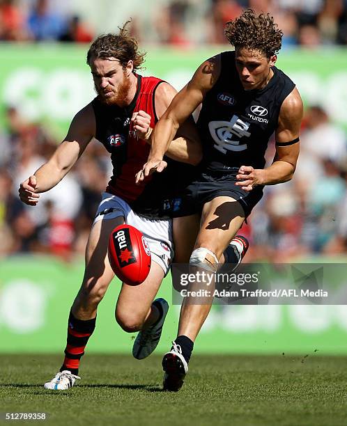 Charlie Curnow of the Blues and Nick Kommer of the Bombers compete for the ball during the 2016 NAB Challenge match between the Carlton Blues and the...