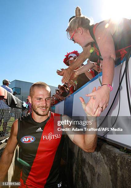 David Zaharakis of the Bombers is congratulated by fans during the 2016 NAB Challenge match between the Carlton Blues and the Essendon Bombers at...