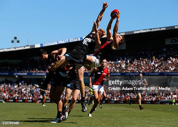 Joe Daniher of the Bombers attempts to mark over Andrew Phillips of the Blues during the 2016 NAB Challenge match between the Carlton Blues and the...