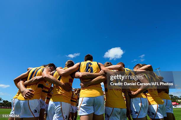 The Adelaide Crows huddle up before the bounce during the 2016 NAB Challenge match between Fremantle Dockers and the Adelaide Crows at Sounness Park,...