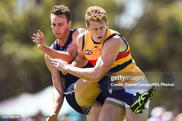 Reilly O'Brien of the Crows bumps Jonathon Griffin of the Dockers off his kick during the 2016 NAB Challenge match between Fremantle Dockers and the...